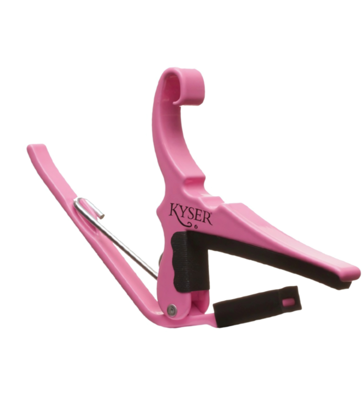 Kyser KG6PRA Pink Revival Capo for 6-string acoustic guitar, Side view of Kyser KG6PRA capo with vibrant pink finish, Kyser Pink capo on acoustic guitar neck, Kyser quick-change capo pink edition front view, Limited edition Kyser Pink Revival Capo with headstock parking