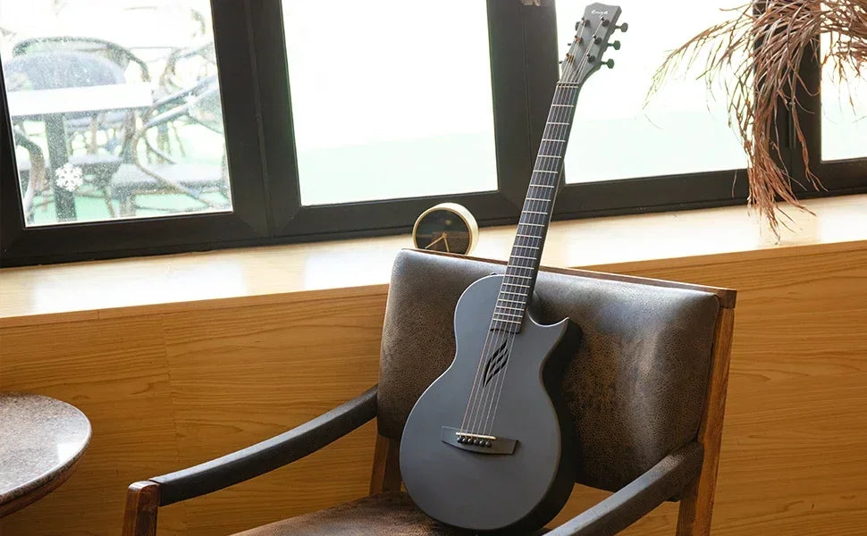 A side-angle shot showing the compact 35″ scale-length of the Enya Nova Go travel guitar.