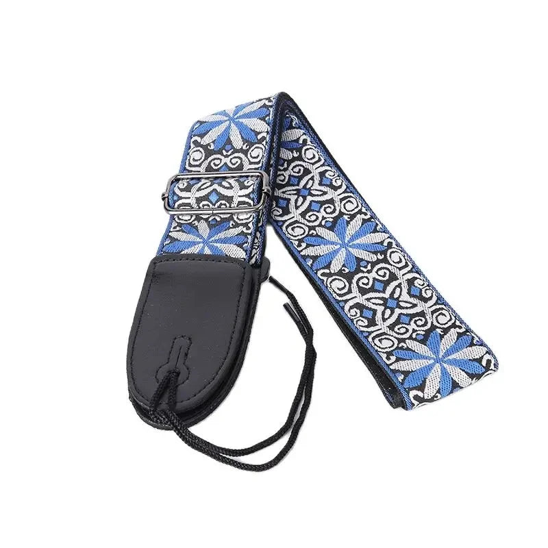Stylish view of the jacquard cotton strap securely fastened to a vibrant electric guitar, showcasing the versatility and durable construction required for heavier instruments like bass and electric models