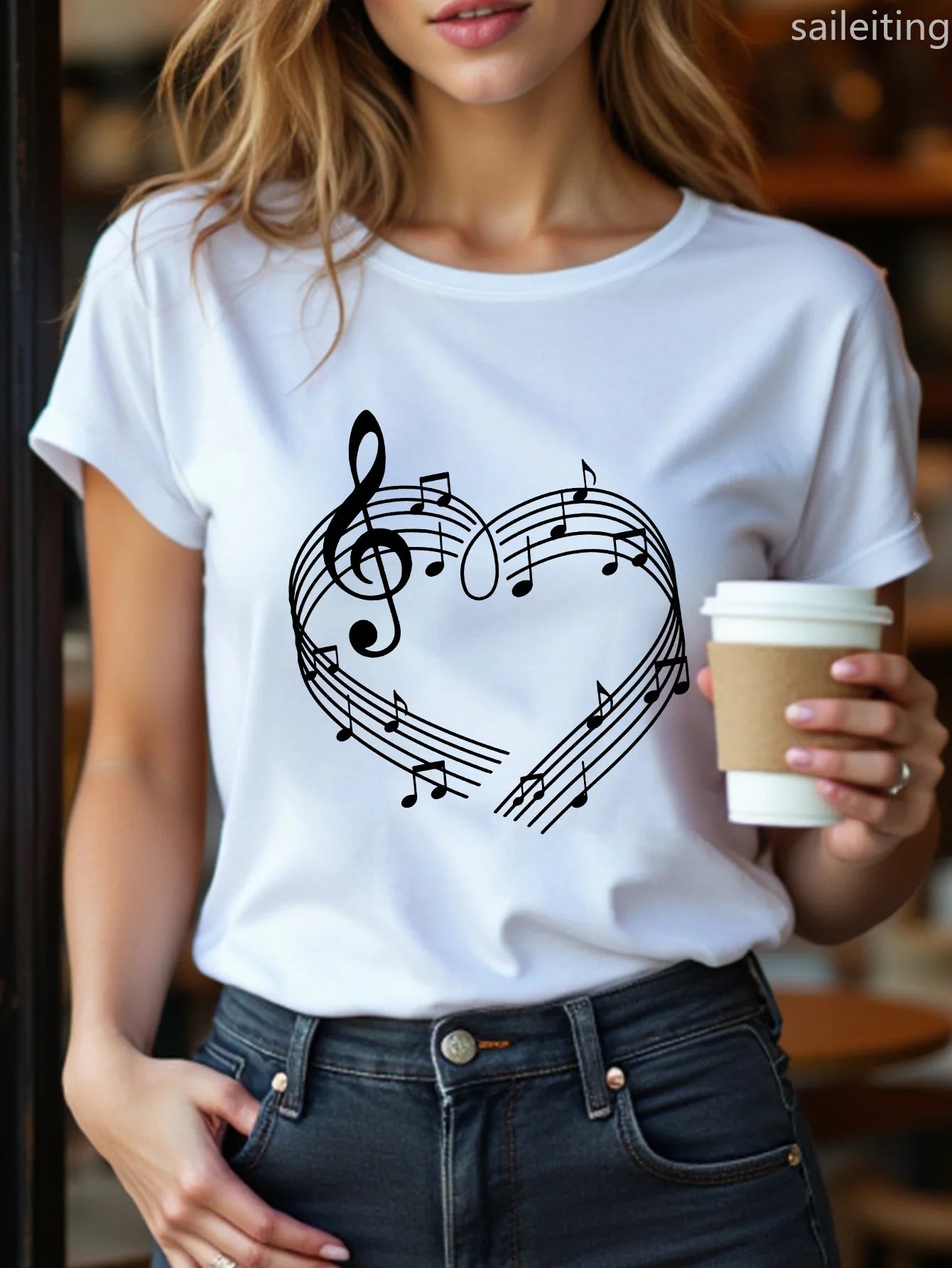 Front view of the women’s white t-shirt with a heart and music note print, styled on a mannequin or flat-lay.