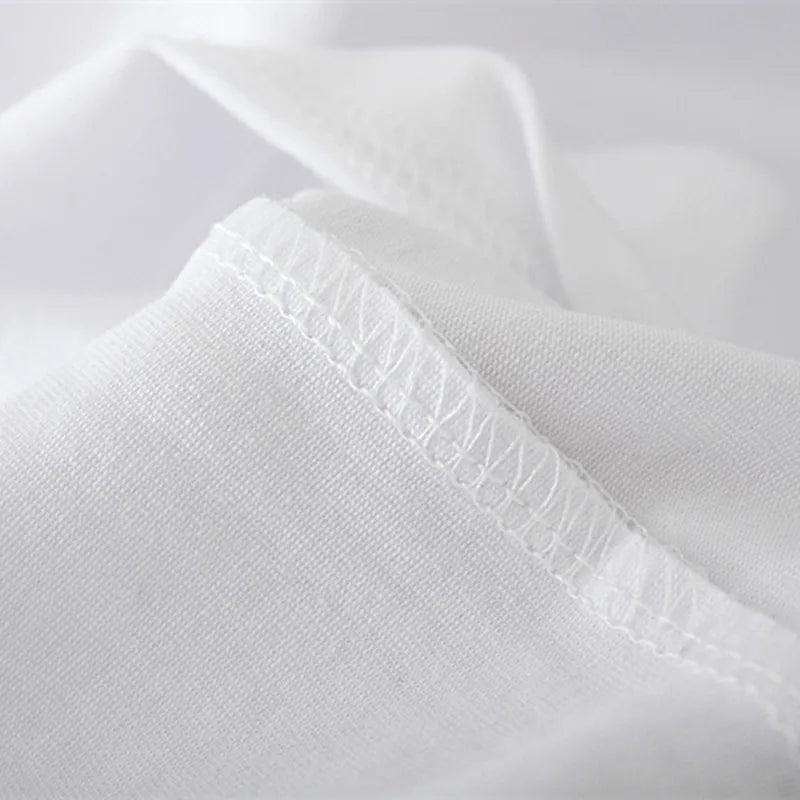 Detailed shot of the cotton fabric texture of the t-shirt, showing softness and weave.