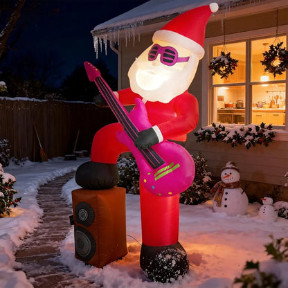 Inflated Santa glowing with LED lights at night, surrounded by other Christmas decorations.