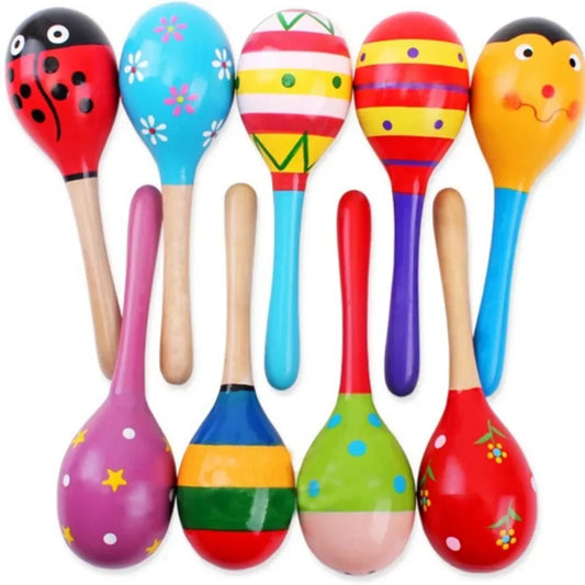 Front view of the Montessori wooden rattle and shaker set showing bell, sand hammer, and colorful design.