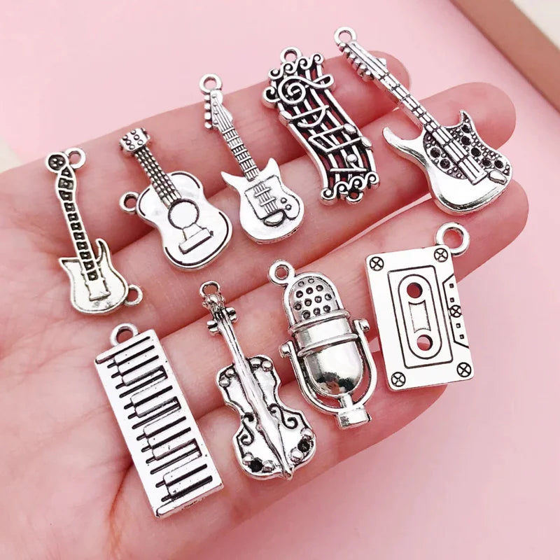 Close-up of the silver guitar charm from the music instrument charm collection for DIY jewelry.