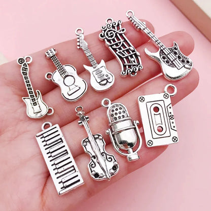Close-up of the silver guitar charm from the music instrument charm collection for DIY jewelry.
