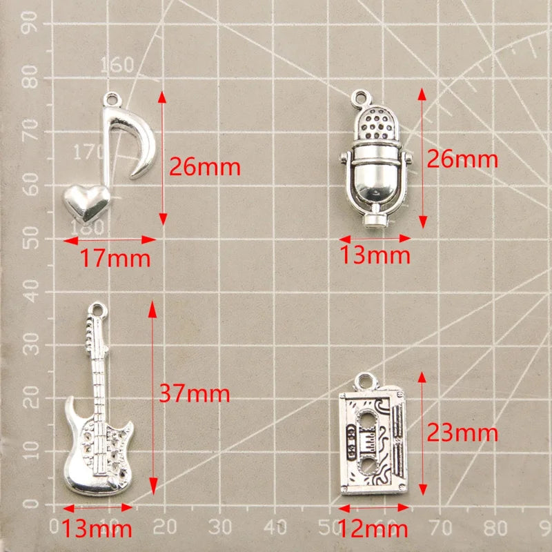 Detailed view of the silver microphone pendant charm, perfect for music-themed accessories.