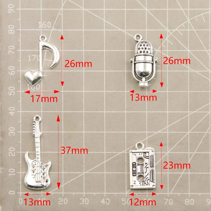 Detailed view of the silver microphone pendant charm, perfect for music-themed accessories.