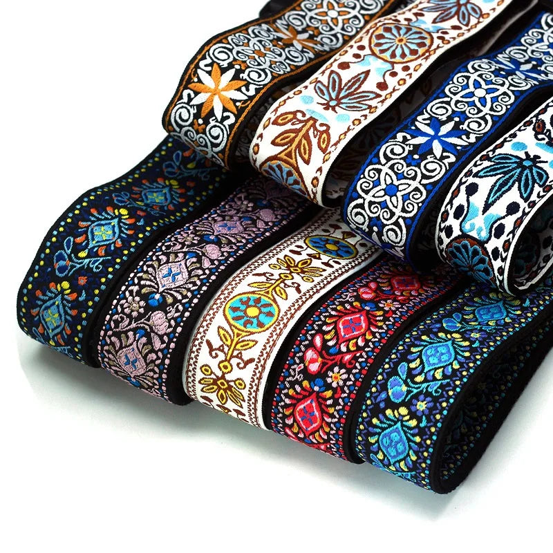 Close-up view of the unique vintage embroidered jacquard design guitar strap, showcasing the rich colors, durable cotton weave, and the entire adjustable length for all types of musicians.