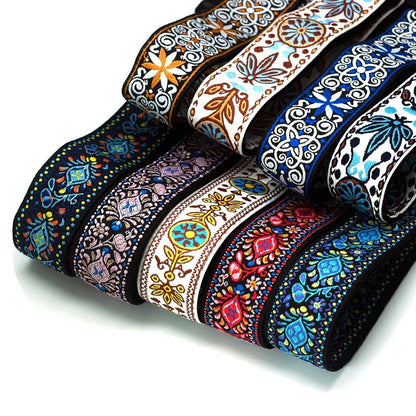 Close-up view of the unique vintage embroidered jacquard design guitar strap, showcasing the rich colors, durable cotton weave, and the entire adjustable length for all types of musicians.